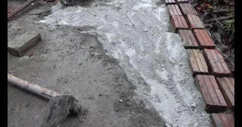 Man pouring concrete yard Stock Footage 312200891