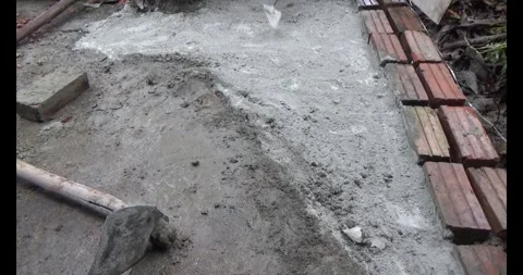 Man pouring concrete yard Stock Footage 312201452