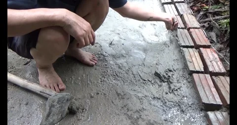 Man pouring concrete yard Stock Footage 312202919