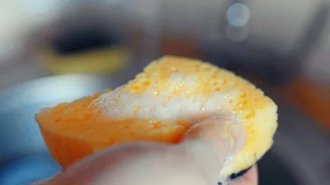 Man pouring detergent on a litchen sponge closeup. Home routine,everyday life co Video stock 304752268