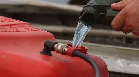 Man pouring fuel Stock Footage 41102247