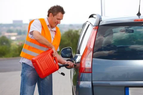 Man pouring fuel Stock Photos