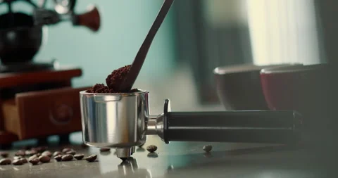 Man pouring ground coffee. View hand from a wooden spoon pours ground coffee Video stock 247294212