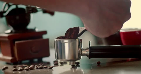 Man pouring ground coffee. View hand from a wooden spoon pours ground coffee Stock Footage 264420535
