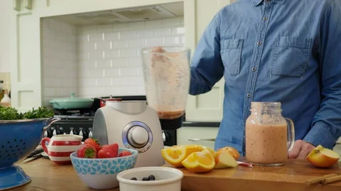 Man Pouring Healthy Smoothie From Blender In Jar At Kitchen Stock Footage 86074053