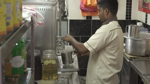 Man Pouring Hot Tea Into A Cup, Malaysia. Stock Footage 122096863