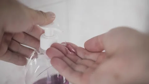 Man pouring liquid soap into hand closeup in bathroom vertical video reel Stock Footage 342240397