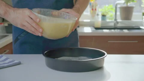 Man pouring mixture into a cake pan Video stock 199210319