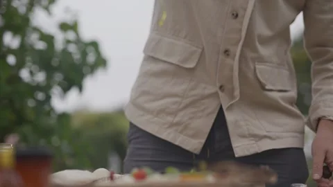 A man is pouring something into a white cup Video stock 297842370