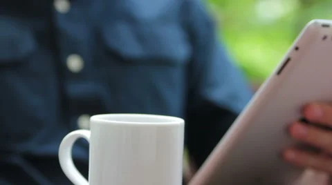 Man pouring tea on the balcony Stock Footage 40664594