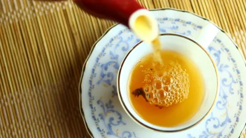 Man is pouring  tea  in a cup, in studio   Chiangmai  Thailand. Stock Footage 169850416