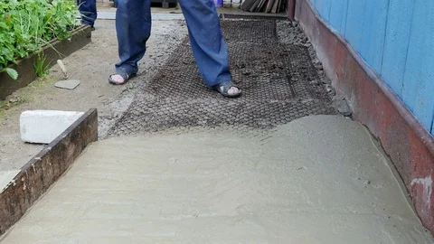 Man pours the cement out of the bucket 스톡 동영상 80291615