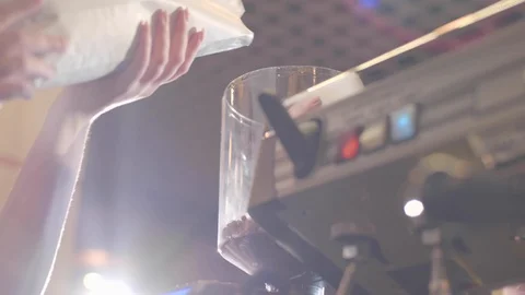  Man pours coffee into a coffee machine Stock Footage 117578645