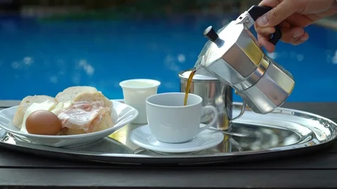 Man pours a coffee into the cup Stock Footage 112085877