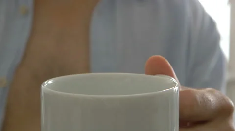 Man pours a cup of coffee Stockbeeldmateriaal 51332737