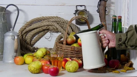 A man pours a glass of cider, close up Stock Footage
