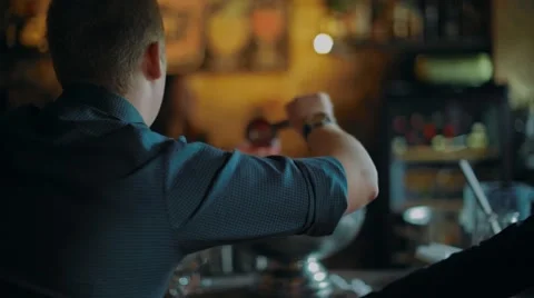 Man pours himself a drink Stock Footage 67532147