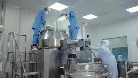 Man pours the liquid substance to automated machine for mixing and making drugs Stock Footage 200856046