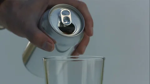 Man Pours Nitro Cold Brew Coffee Into Top of Clear Glass in Slow Motion Stock Footage 75123078