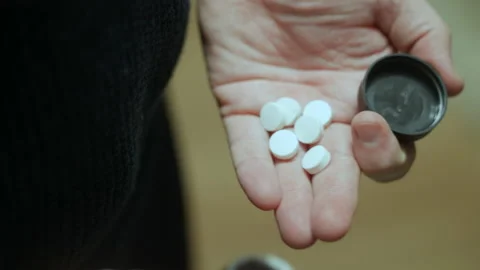 https://images.pond5.com/man-pours-pills-his-hand-footage-147636661_iconl.jpeg