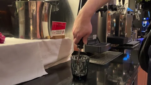 Man Pours Red Wine at Buffet: Self-Serve Elegance in Action Stock Footage 303716213