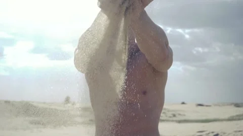 Man pours sand through his fingers Video stock 89690654