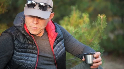 Man pours tea and takes a sip of tea. Stock Footage 120189479
