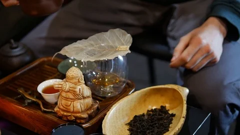Man pours tea from the kettle, tea ceremony. Stock Footage 107514134