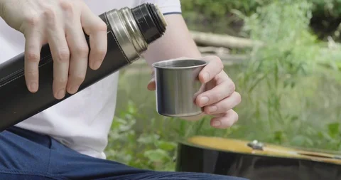 Man Pours Tea Into A Thermos Stock Footage 112154995