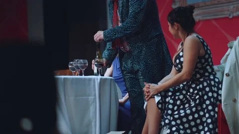 A man pours wine into glasses Stock Footage 219752993