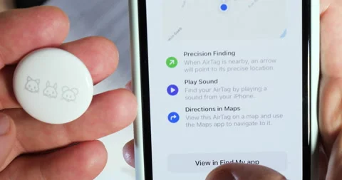 Man pov setting up AirTag setup on the iPhone Stock Footage 153401064