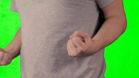 Man Powering Up in front of green screen Stock Footage 103154512