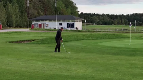 Man practice golf in the Swedish summer Stock Footage 250404822
