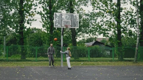 Man practices his shooting. Father with daughter enjoy day Stock Footage 334024189