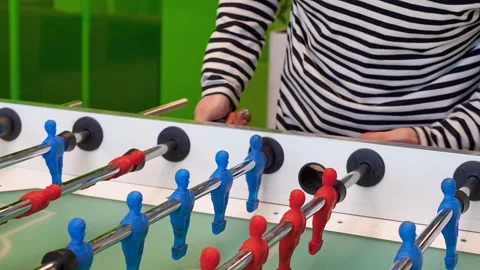 A man practices kicker table football throws, Recreation and leisure concept Stock Footage 306286301