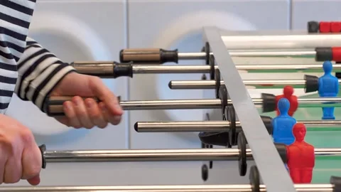 A man practices kicker table football throws, Recreation and leisure concept Stock Footage 306286323