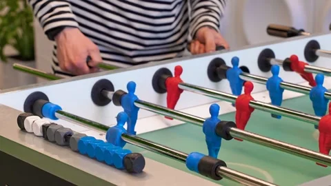 A man practices kicker table football throws, Recreation and leisure concept Stock Footage 306286327