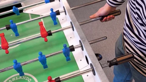 A man practices kicker table football throws, Recreation and leisure concept Stock Footage 306286352