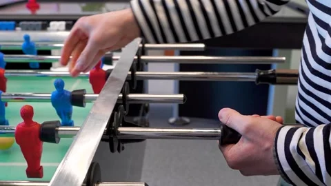 A man practices kicker table football throws, Recreation and leisure concept Stock Footage 306286356