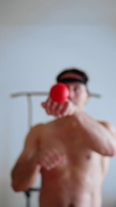 Man practices visual reflexes at home, man performs reaction drills using red Stock Footage 321406537