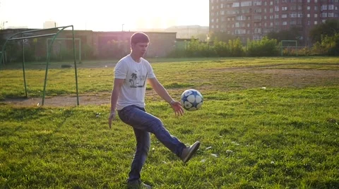 Man practicing with a ball on the soccer field Video stock 67455685