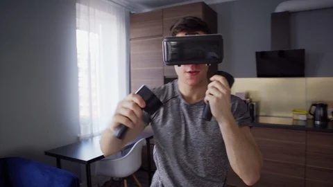 Man practicing boxing punches in vr headset Stock Footage 128758344