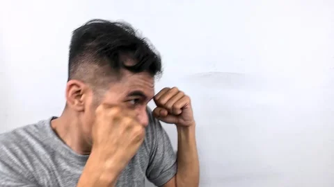 Man Practicing Boxing Punching Against White Wall. Stock Footage 315230071