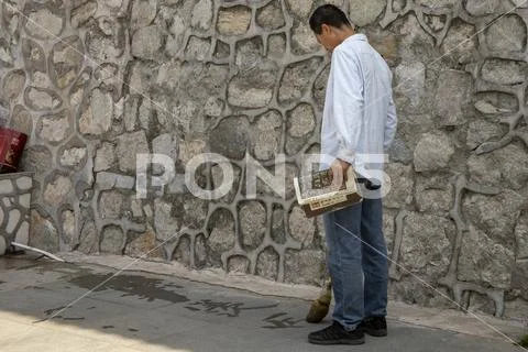Man practicing Chinese calligraphy Stock Photos
