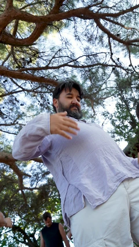 Man Practicing Dance Yoga Movements Under Trees izmir, Turkey,Sept 13, 2025 Stock Footage 328437660
