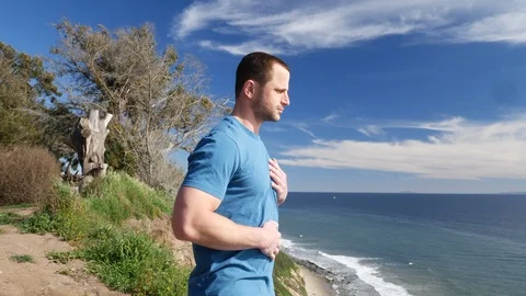 A man practicing deep breathing and meditation to relieve stress on an Stock Footage 106850926