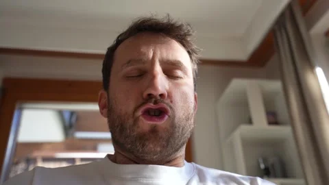 Man practicing deep breathing meditation indoors Vidéo 328228285