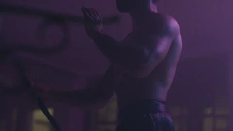 Man practicing his moves with nunchucks Stock Footage 279837797