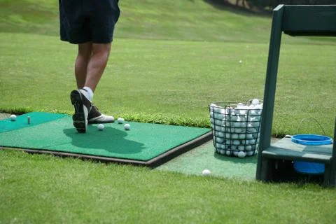 Man practicing his swing at the driving range Stock Photos