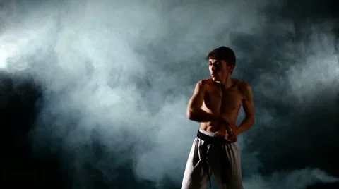 Man  practicing karate or kung fu. Master holding nunchuck. Close up Stock Footage 50492409